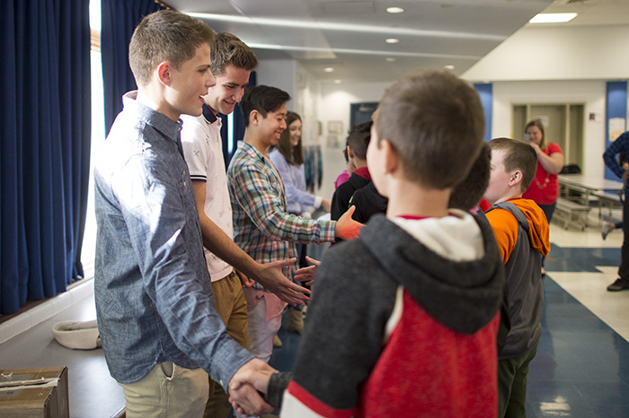 RMHS students shaking hands with Low students
