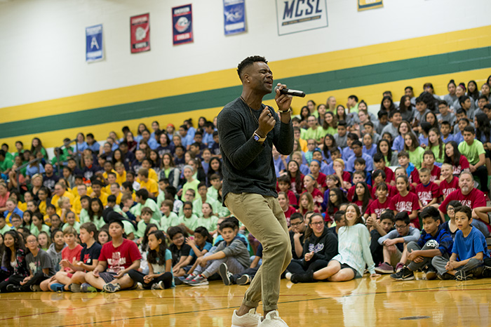 Brandon Fox Singing in front of students